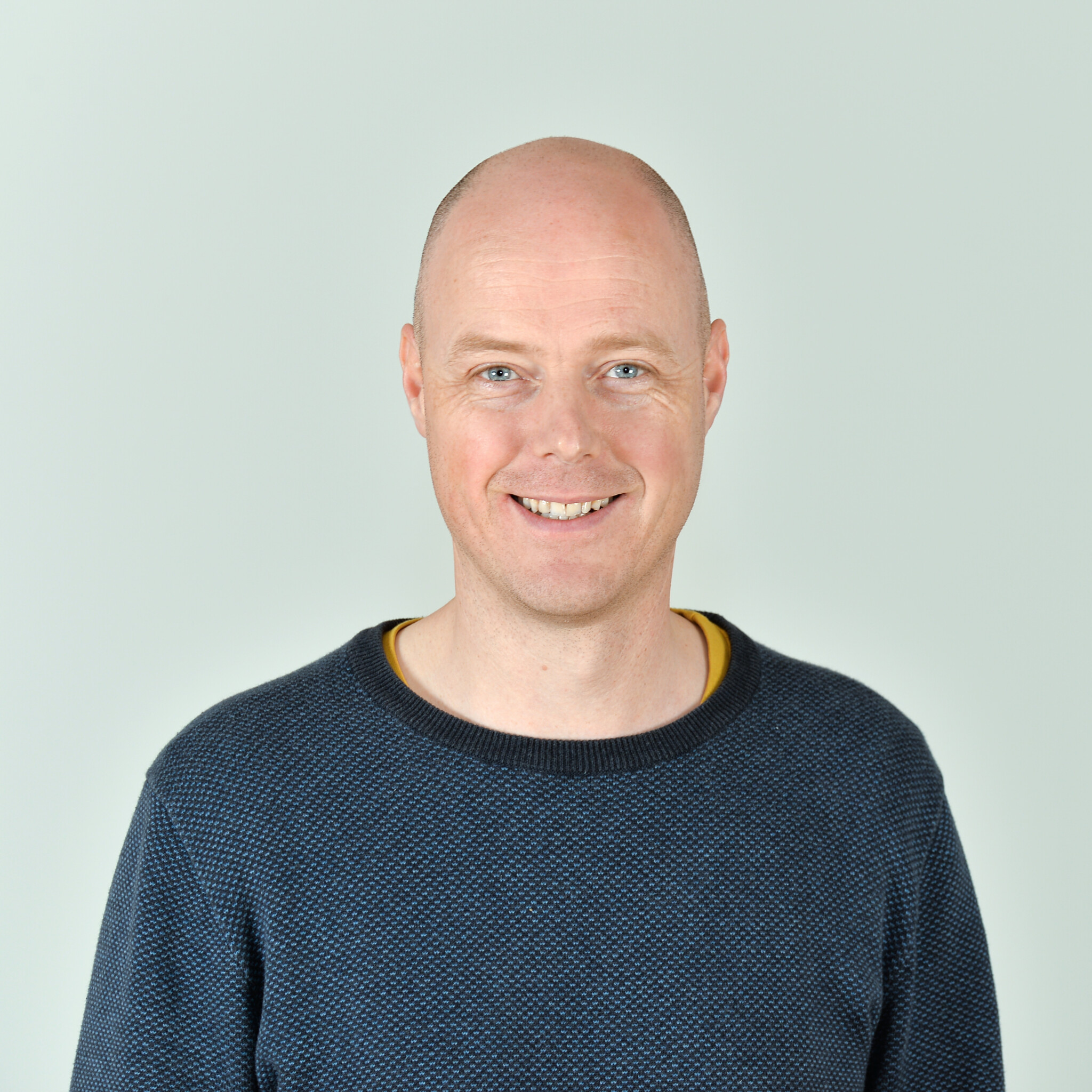 Profilbild von Frank Musekamp im blauen Pullover