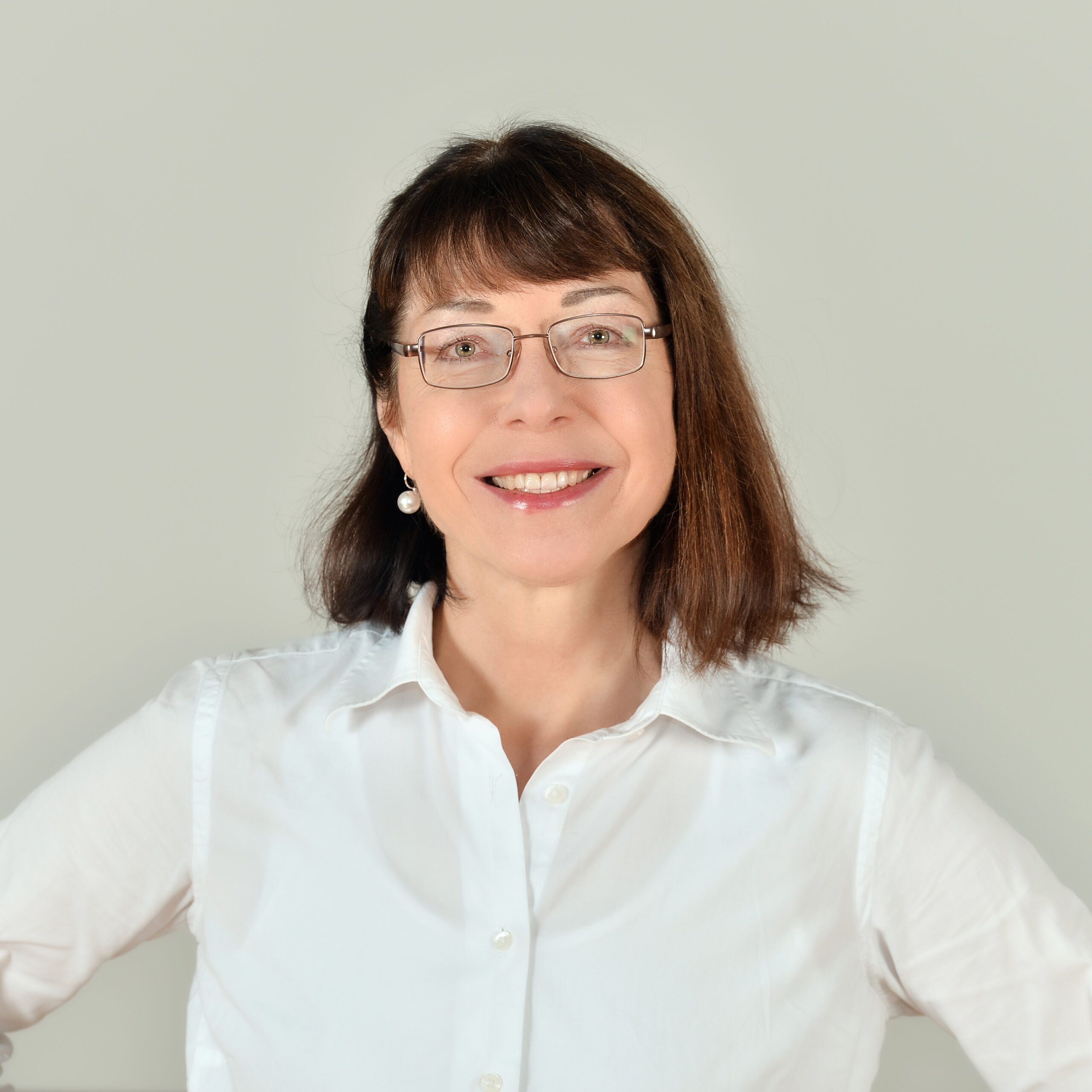 Profilbild von Kristin Reinke in einer weißen Bluse.